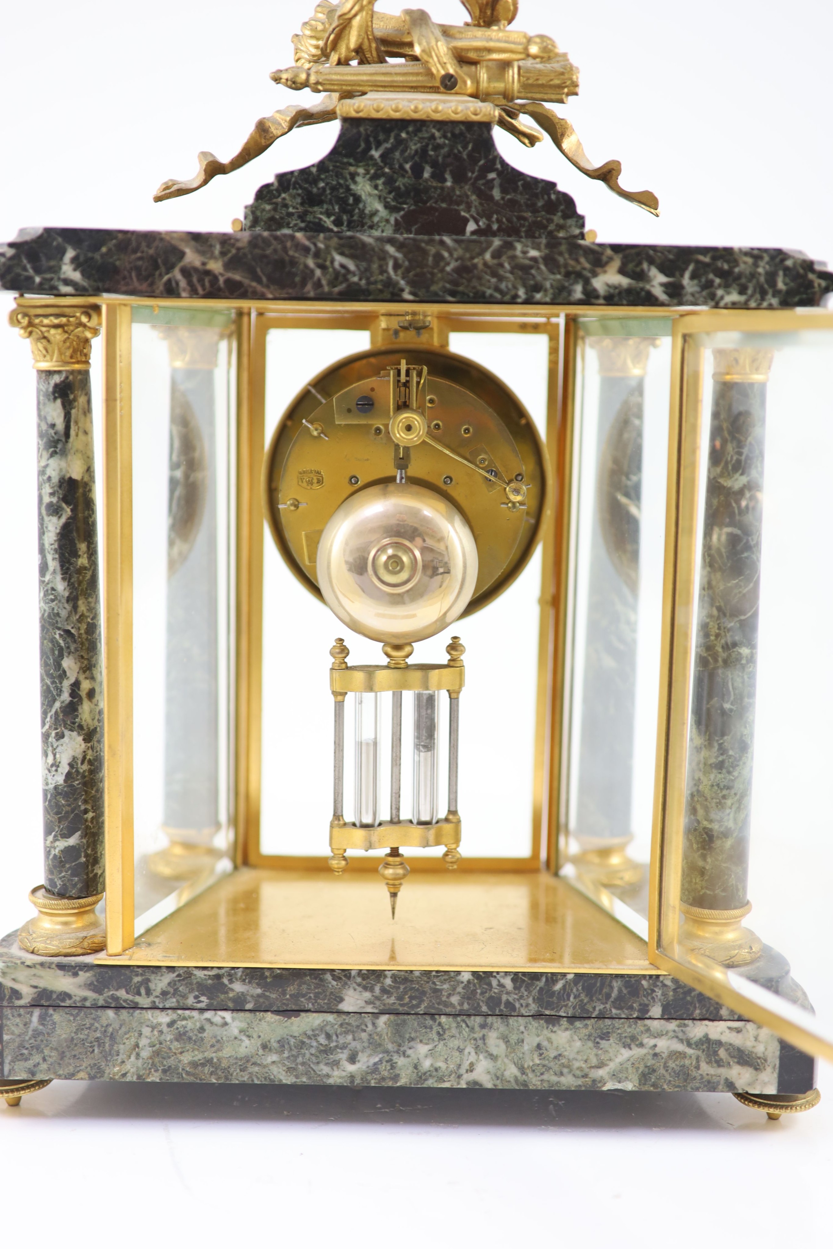 A 19th century French ormolu mounted black variegated three piece clock garniture H 38cm. W 27cm. D 14cm. The urns 31cm high.